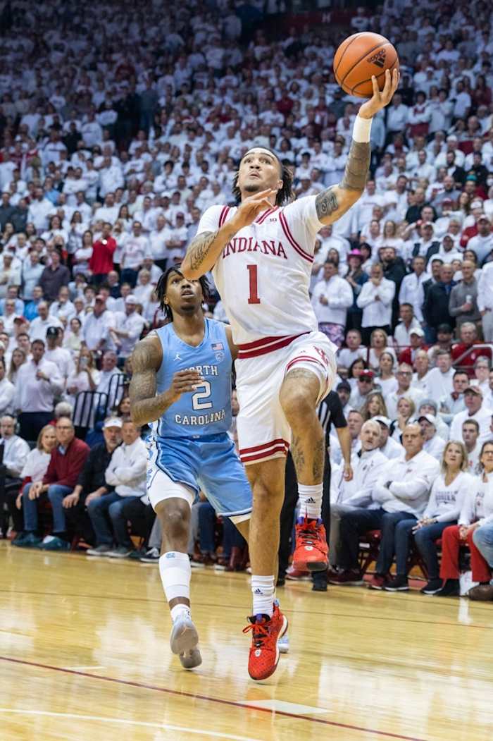 Indiana Hoosiers guard Jalen Hood-Schifino (1) shoots the ball while North Carolina Tar Heels guard Caleb Love (2) defends in the first half.